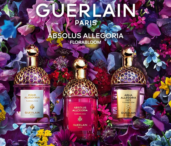 Parfémy Guerlain Absolus Allegoria Florabloom obklopené květinami
